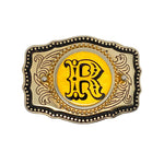Buckle with decorative border and yellow center on a white background