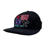 Black cap with embroidered design on a white background