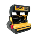 Yellow and black Polaroid camera on a white background