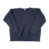 Folded black sweatshirt on a white background