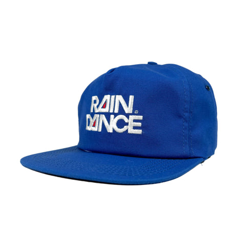 Blue cap with 'RAIN DANCE' text on a white background