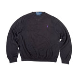 Black sweater with a logo on a white background