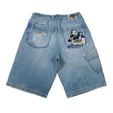 Light blue denim shorts shown from the back, featuring a large embroidered cartoon character on the right back pocket and a small gold embroidered detail on the left back pocket, laid flat on a white background.