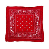 A red bandana with a white paisley pattern, laid flat on a white background.