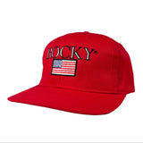 Red cap with 'Rocky' logo and American flag on a white background