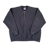 Folded dark gray shirt on a white background