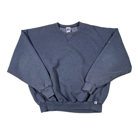 Blue sweatpants with brand logos on a white background