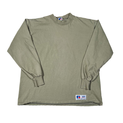 Green long-sleeve shirt with a logo on a white background