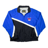 A vintage K-9 Racing windbreaker jacket in royal blue and black with white diagonal stripe accents, laid flat on a white background.