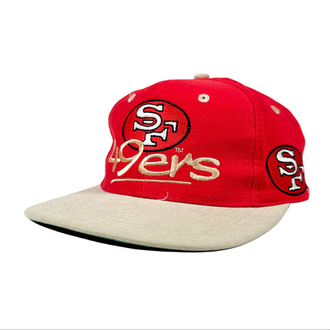 Red and beige cap with San Francisco 49ers logo on a white background