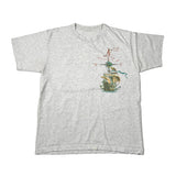 A light heather gray short-sleeve t-shirt with a vintage-style compass graphic on the chest depicting a sailing ship and cardinal directions.