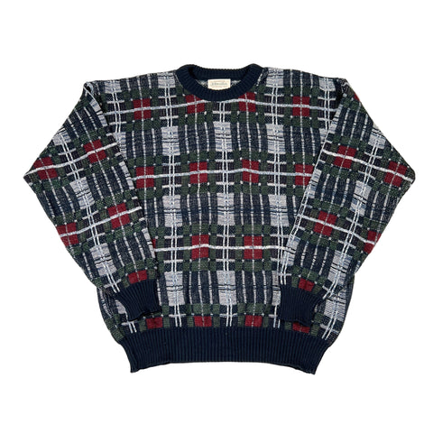 Plaid patterned sweater on a white background