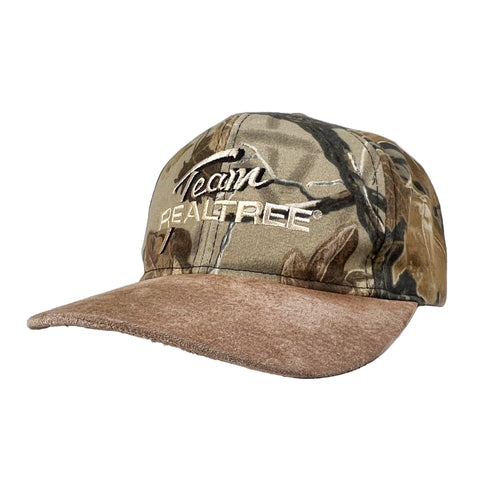 Camouflage cap with brown brim on a white background