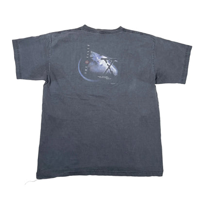 A faded dark gray short-sleeve t-shirt laid flat on a white surface, showing the back with a graphic print of a space shuttle and the text 'THE ORBIT' and 'JAMES TAYLOR'.