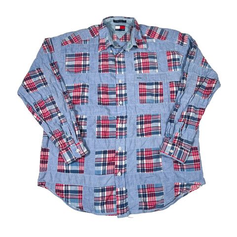 Plaid shirt with blue, red, and white pattern on a white background