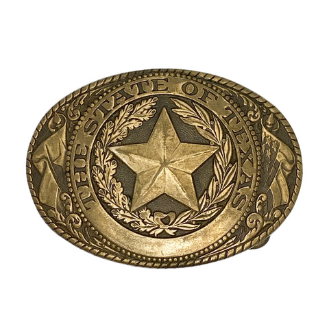 Gold belt buckle with star design and 'The State of Texas' text on a white background