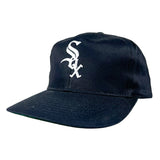 A navy blue baseball cap featuring the white embroidered Chicago White Sox logo on the front, set against a plain light gray background.