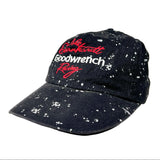A dark navy blue baseball cap with a white speckled acid-wash finish, featuring embroidered red and white text on the front that reads 'Jody Garnerett Goodwrench Racing'.