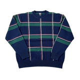 A vintage crewneck knit sweater with a navy blue base, featuring horizontal green stripes and a vertical plaid pattern of thin white and red lines, laid flat on a white background.