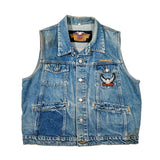 A light blue denim motorcycle vest with snap-button front, chest pockets, and embroidered winged logos on the chest and inner neck label.
