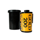 Film canister labeled 'Gold 200' on a textured white surface