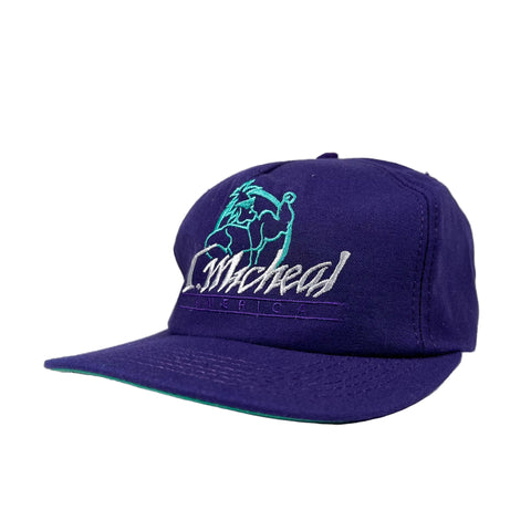Purple cap with green and white logo on a white background