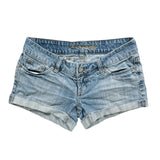 Pair of denim shorts on a white background