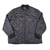 Black quilted jacket on a white background