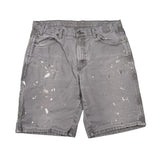 Gray shorts with paint splatter pattern on a white background