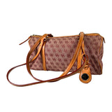 Brown handbag with patterned surface and tan leather strap on a white background