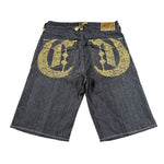 Denim shorts with gold embroidery on a white background