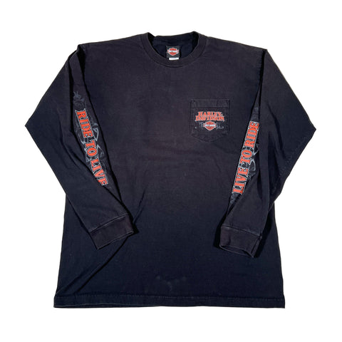 Black long-sleeve shirt with red and orange text on sleeves and chest pocket, on a white background