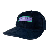 A dark navy blue corduroy baseball cap with a rectangular embroidered patch on the front. The patch is purple with the text 'JIMMY Z' in black and outlined in green.