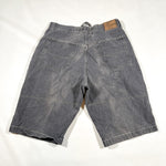 Blue denim shorts on a white background