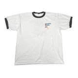 White t-shirt with black trim and graphic design on a light gray background