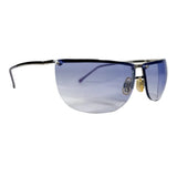 A pair of rimless shield-style sunglasses with blue-tinted lenses and a thin dark metal frame, photographed on a plain light background.