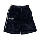 Black velour shorts with a white side stripe and a white South Pole logo on the left leg, laid flat on a white background.