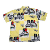 Yellow shirt with graphic designs of trucks and text on a white background