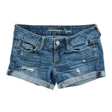 Blue denim shorts with 'American Eagle' branding on a white background