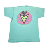 A mint green short-sleeve t-shirt laid flat on a white surface, featuring a large retro circular graphic on the back with the words 'EITE IT GOOD DOG' and a stylized dog face.