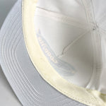 white goodyear hat